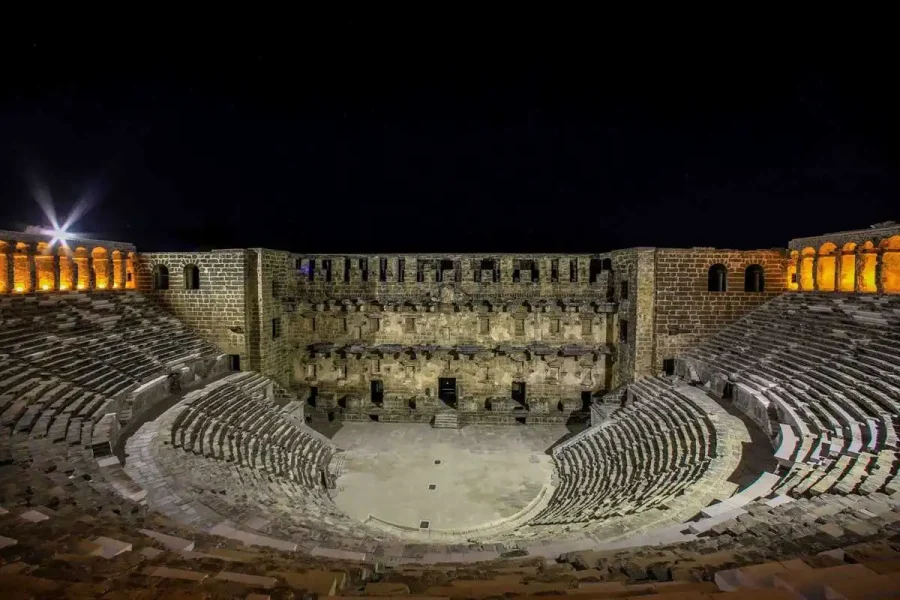 Aspendos Theatre illuminated at night during the Perge & Aspendos Evening Tour