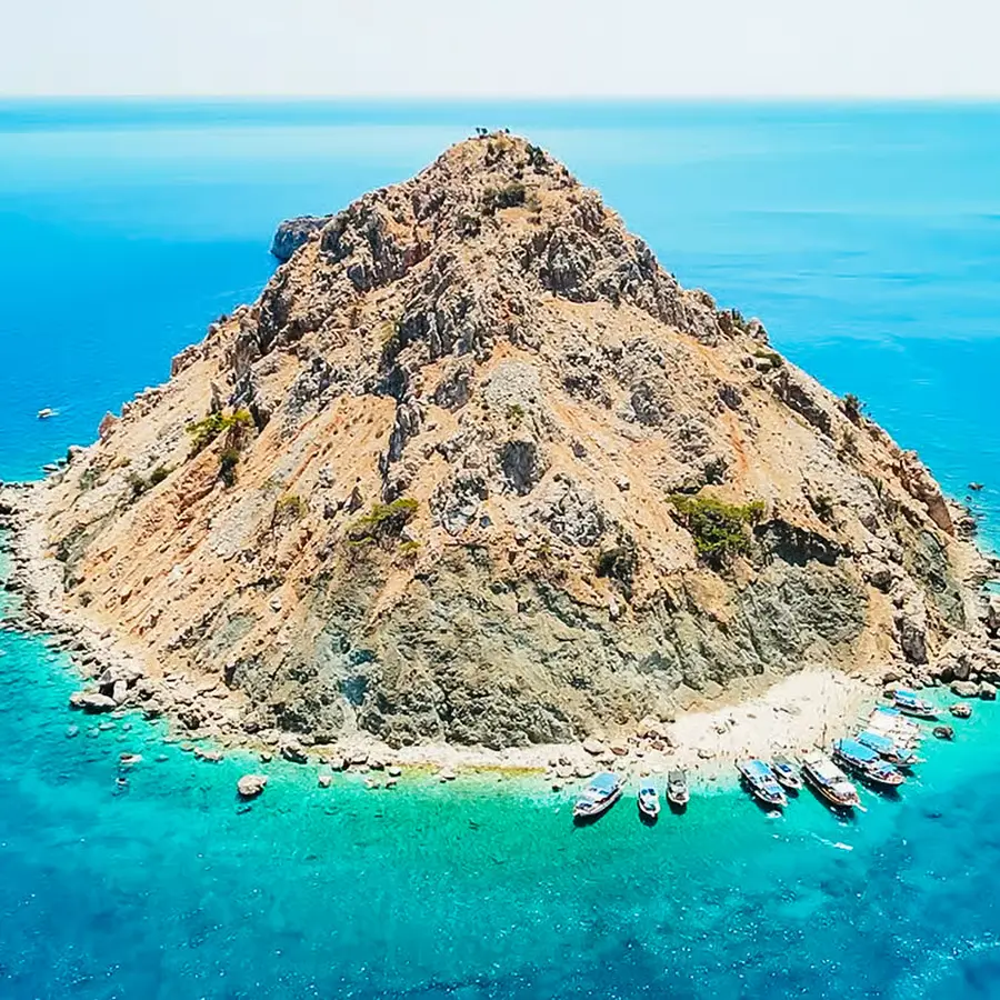 White-sand beach at Suluada with bright turquoise water